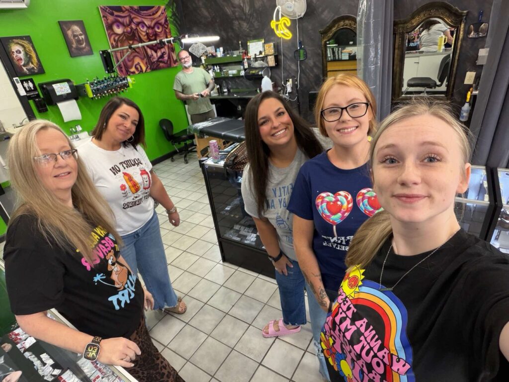 Five friends at Off Grid Tattoo in Ellijay, GA, during their group tattoo and piercing visit