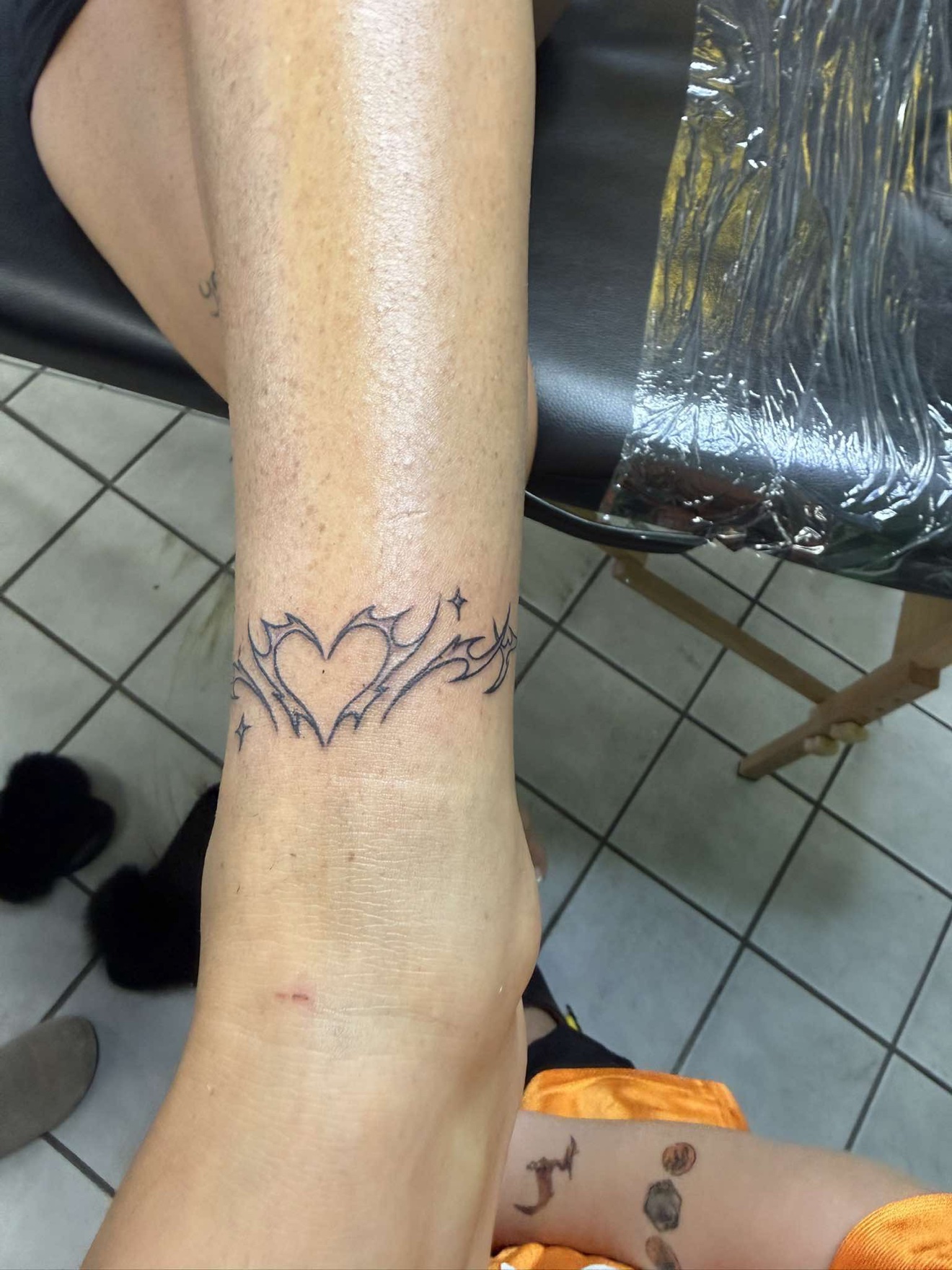Heart and tribal points ankle band tattoo at Off Grid Tattoo in Ellijay GA